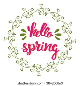 Hello Spring. Hand lettering, calligraphy inscription with spring leaves.