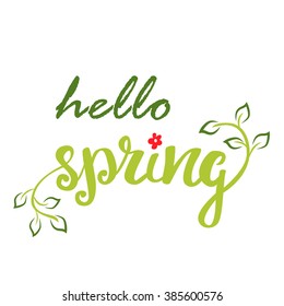 Hello Spring. Hand lettering, calligraphy inscription with spring leaves.