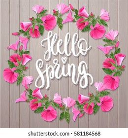 Hello Spring. Handwritten vintage lettering quote. Vector illustration on wooden background with decorative pink flowers for greeting card, poster or leaflet.
