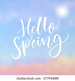 Hello Spring. Inspirational saying at blue sky background with cloud. Spring season greeting