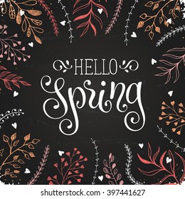 Hello spring lettering with doodle branches on chalkboard. Spring time wording. Modern calligraphy for greeting card design. 