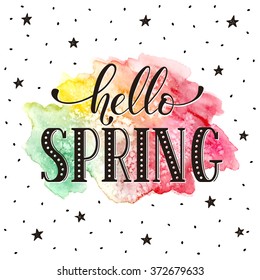 Hello spring lettering with watercolor spot on background. Modern calligraphy. Colorful greeting card design. 