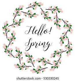 Hello! Spring. Spring wreath of cherry blossom with the text in the middle.