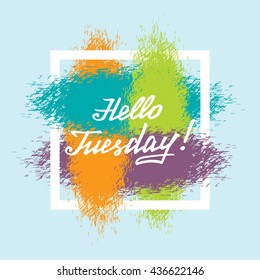 Hello Tuesday white lettering phrase in colorful grunge frame of shabby paint brushstrokes.