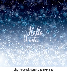 Hello Winter background with snowflakes and bokeh effect.