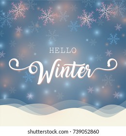 Hello winter banner with calligraphy brush on blue winter background with snow, snowflakes and little bokeh lights in blue and pink. Vector card design with typography.