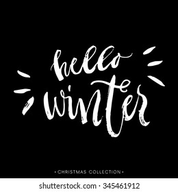 Hello Winter. Christmas calligraphic card. Handwritten modern brush lettering. Hand drawn design elements.