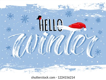 Hello Winter handlettering inscription. Winter elegant modern brush lettering on blue snowflake background. Hand drawn winter inspiration phrase. Vector illustration