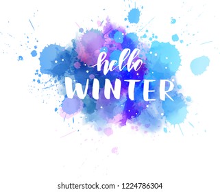Hello winter - handwritten modern calligraphy lettering message on watercolor paint splash. Season and holiday concept illustration.