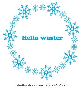 Hola invierno. Inscripción en un marco redondo de copos de nieve sobre un fondo blanco