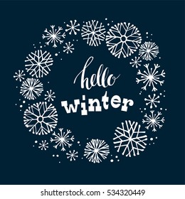 Hello winter. Lettering design on snow background with hand drawn snowflake frame. Design element for poster, card, flyer and other users