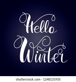 Hello winter lettering on the  blue  background .