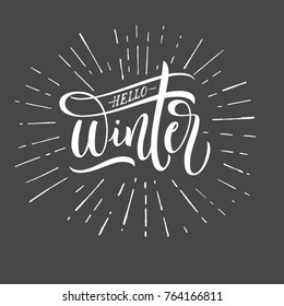 Hello Winter lettering typography. Inspirational quote. Typography for calendar or poster, invitation, greeting card or t-shirt. Vector lettering, calligraphy design.