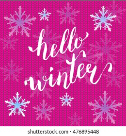 Hello winter text on pink knitting background. Vector Brush lettering Hello Winter. Vector card design with custom calligraphy. Winter season cards, greetings for social media