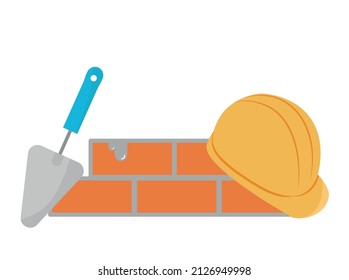 helmet with bricks and trowel