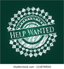 Help Wanted chalk emblem written on a blackboard