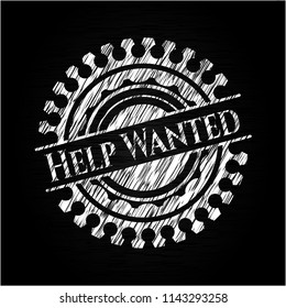 Help Wanted chalkboard emblem written on a blackboard