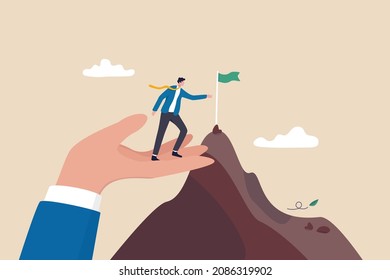 Helping hand, coaching or mentor support employee to achieve business target, inspiration or advantage to reach goal concept, businessman stand on giant helping hand to reach mountain peak target flag