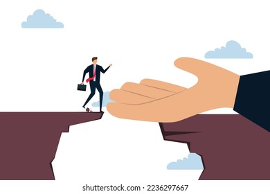 Helping hand support in career development, god hand reach to help or recuse businessman cross the cliffs.