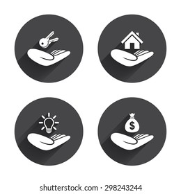 Helping hands icons. Financial money savings insurance symbol. Home house or real estate and lamp, key signs. Circles buttons with long flat shadow. Vector