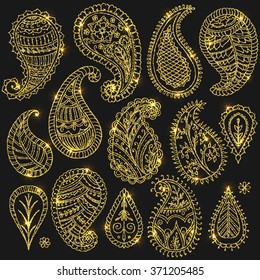 Henna doodles floral vector elements with glitter. Shiny Paisley. Isolated. Hand drawn illustration. Glowing golden Indian ornaments.