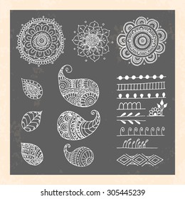 Henna tattoo doodle vector elements on black background. Abstract floral vector illustration design elements.