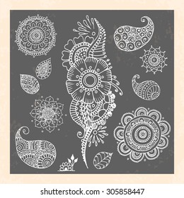 Henna tattoo doodle vector elements on black background. Abstract floral vector illustration design elements.