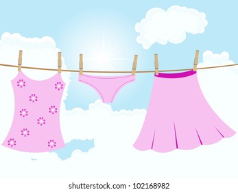 Her pink clothes hanging on the rope