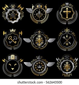 Heraldic decorative emblems made with royal crowns, animal illustrations, religious crosses, armory and medieval castles. Collection of symbols in vintage style.