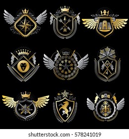 Heraldic decorative emblems made with royal crowns, animal illustrations, religious crosses, armory and medieval castles. Collection of symbols in vintage style.