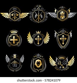 Heraldic decorative emblems made with royal crowns, animal illustrations, religious crosses, armory and medieval castles. Collection of symbols in vintage style.