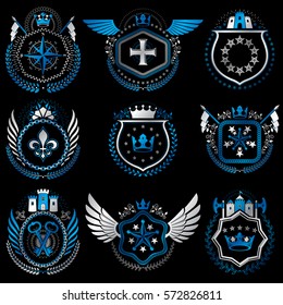 Heraldic emblems with wings isolated on white backdrop. Collection of vector symbols in vintage style created using heraldry elements like crowns, towers, crosses and armory.