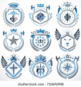 Heraldic emblems with wings isolated on white backdrop. Collection of vector symbols in vintage style created using heraldry elements like crowns, towers, crosses and armory.