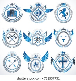 Heraldic emblems with wings isolated on white backdrop. Collection of vector symbols in vintage style created using heraldry elements like crowns, towers, crosses and armory.