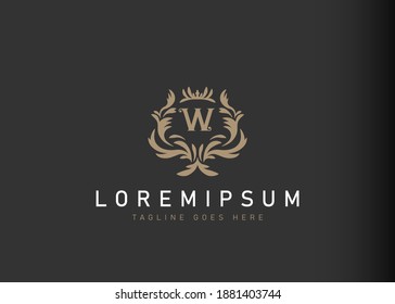 Heraldic initial letter W logo design. Vector illustration of elegant floral initial letter W icon design. Modern logo design with emblem style.