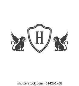 Heraldic lions and monogram on shield Isolated on white background vector icon in retro style. Can be used for crest logo or heraldic badge.
