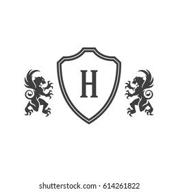 Heraldic lions and monogram on shield Isolated on white background vector icon in retro style. Can be used for crest logo or heraldic badge.