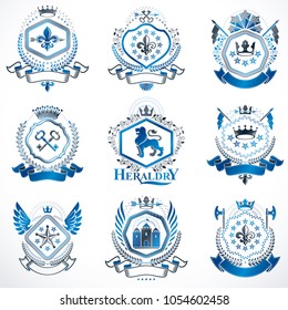 Heraldic vector signs decorated with vintage elements, monarch crowns, religious crosses, armory and animals. Set of classy symbolic graphic insignias.