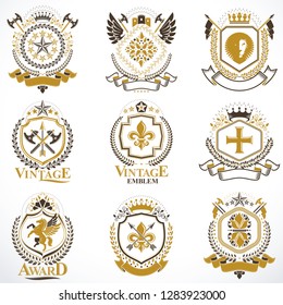 Heraldic vector signs decorated with vintage elements, monarch crowns, religious crosses, armory and animals. Set of classy symbolic graphic insignias.