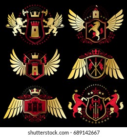 Heraldic vector signs decorated with vintage elements, monarch crowns, religious crosses, armory and animals. Set of classy symbolic graphic insignias with bird wings.