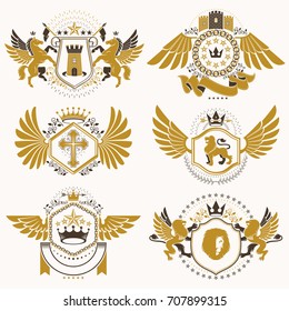 Heraldic vector signs decorated with vintage elements, monarch crowns, religious crosses, armory and animals. Set of classy symbolic graphic insignias with bird wings.