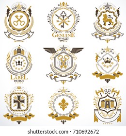 Heraldic vector signs decorated with vintage elements, monarch crowns, religious crosses, armory and animals. Set of classy symbolic graphic insignias.