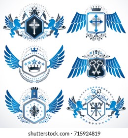 Heraldic vector signs decorated with vintage elements, monarch crowns, religious crosses, armory and animals. Set of classy symbolic graphic insignias with bird wings.