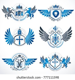 Heraldic vector signs decorated with vintage elements, monarch crowns, religious crosses, armory and animals. Set of classy symbolic graphic insignias with bird wings.