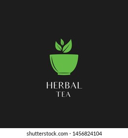 
herbal tea logo design. Simple illustration of green tea leaves flying over the tea bowl