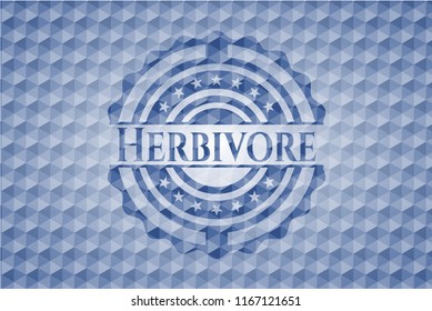 Herbivore blue badge with geometric pattern.