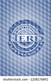 Herd blue badge with geometric pattern.