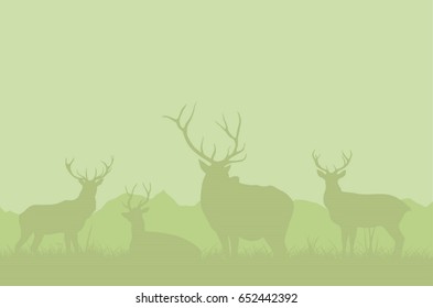 A herd of deer on a green background.