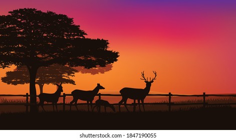 herd of grazing deer behind farm fence with trees and sunset sky - eveing scene vector silhouette design