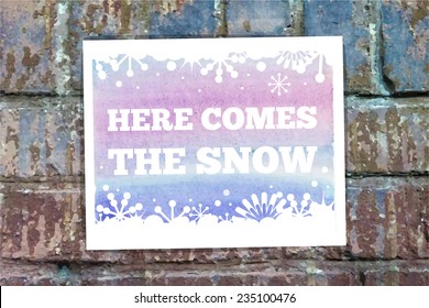 Here comes the snow. Vector Typographical Watercolor Poster on a Brick Wall